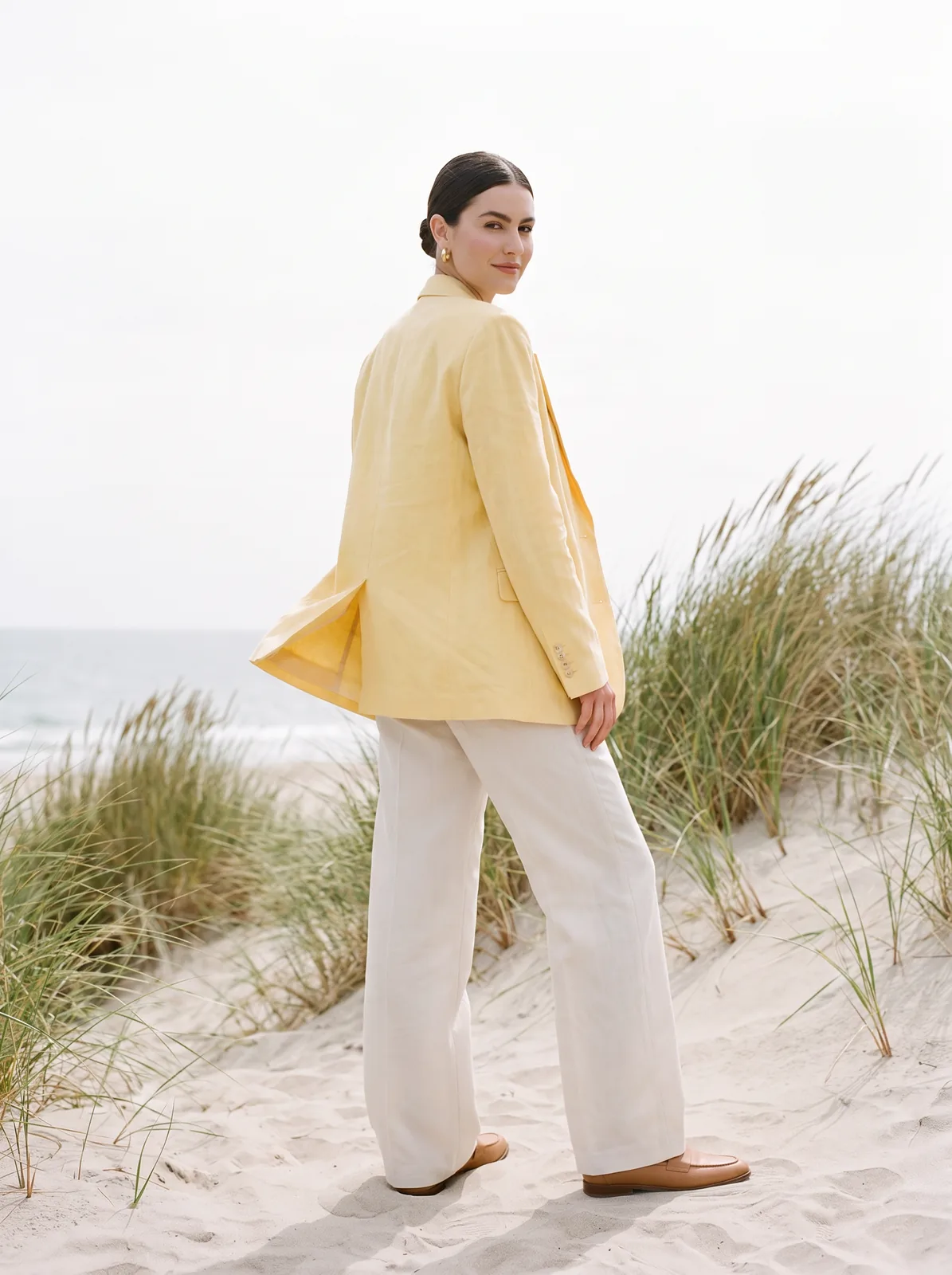 Yellow linen blazer look on an AI model: seaside