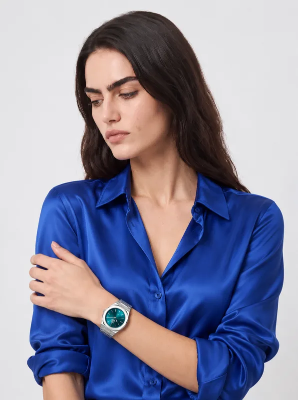 Steel watch on an AI model