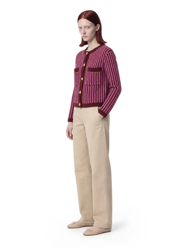 Striped tweed jacket on an AI model, white wall, three-quarter