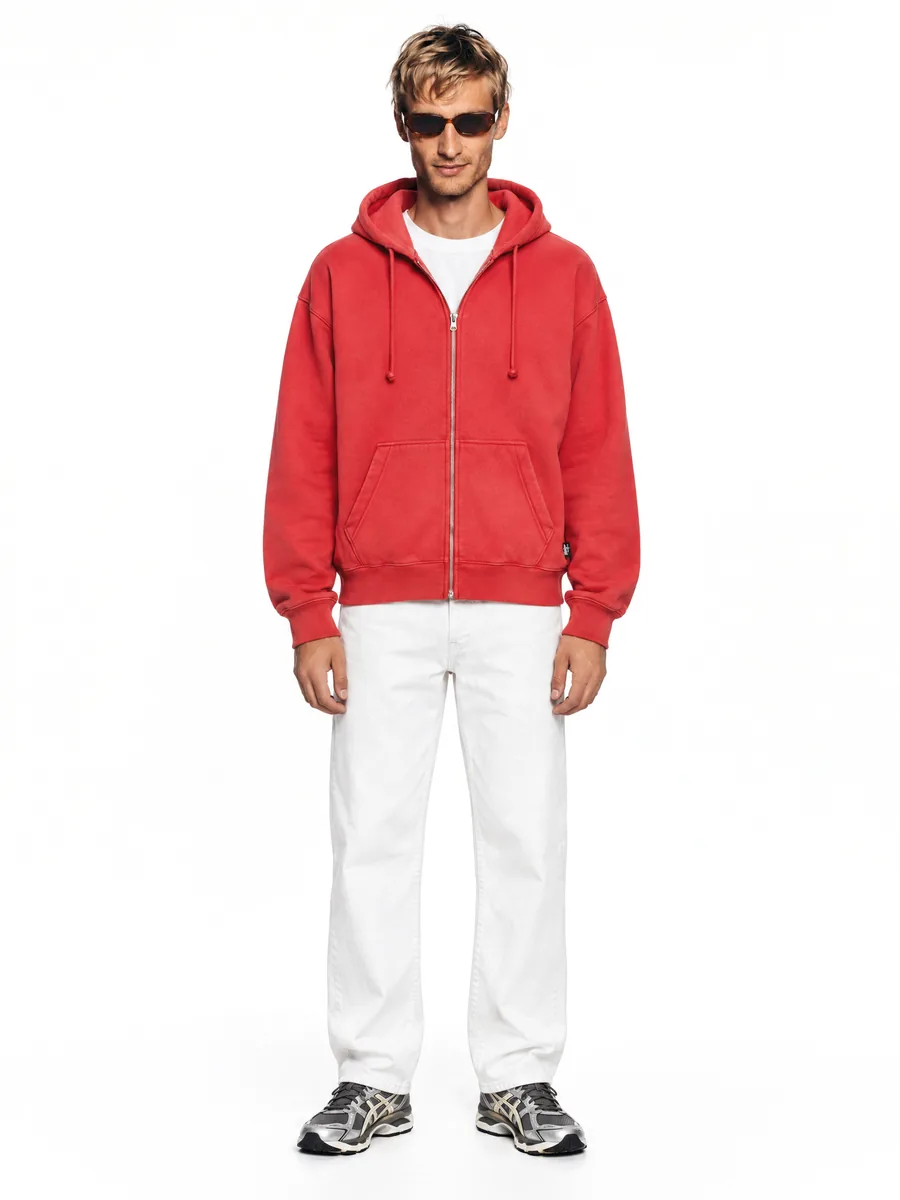 Red Stüssy hoodie on a model in the studio