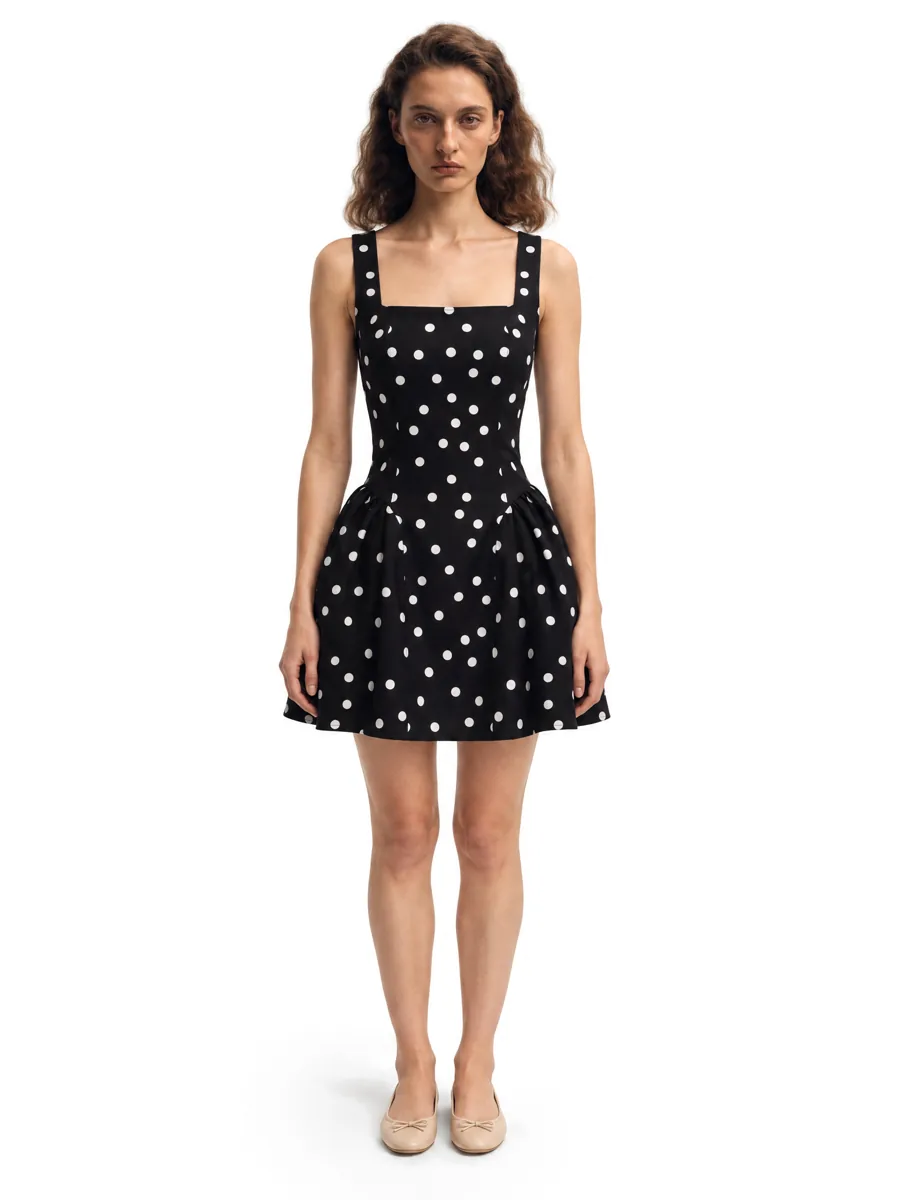 Polka-dot dress on a model, on white